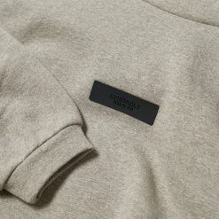 FEAR OF GOD ESSENTIALS KIDS DARK HEATHER OATMEAL TAB HOODIE SS24